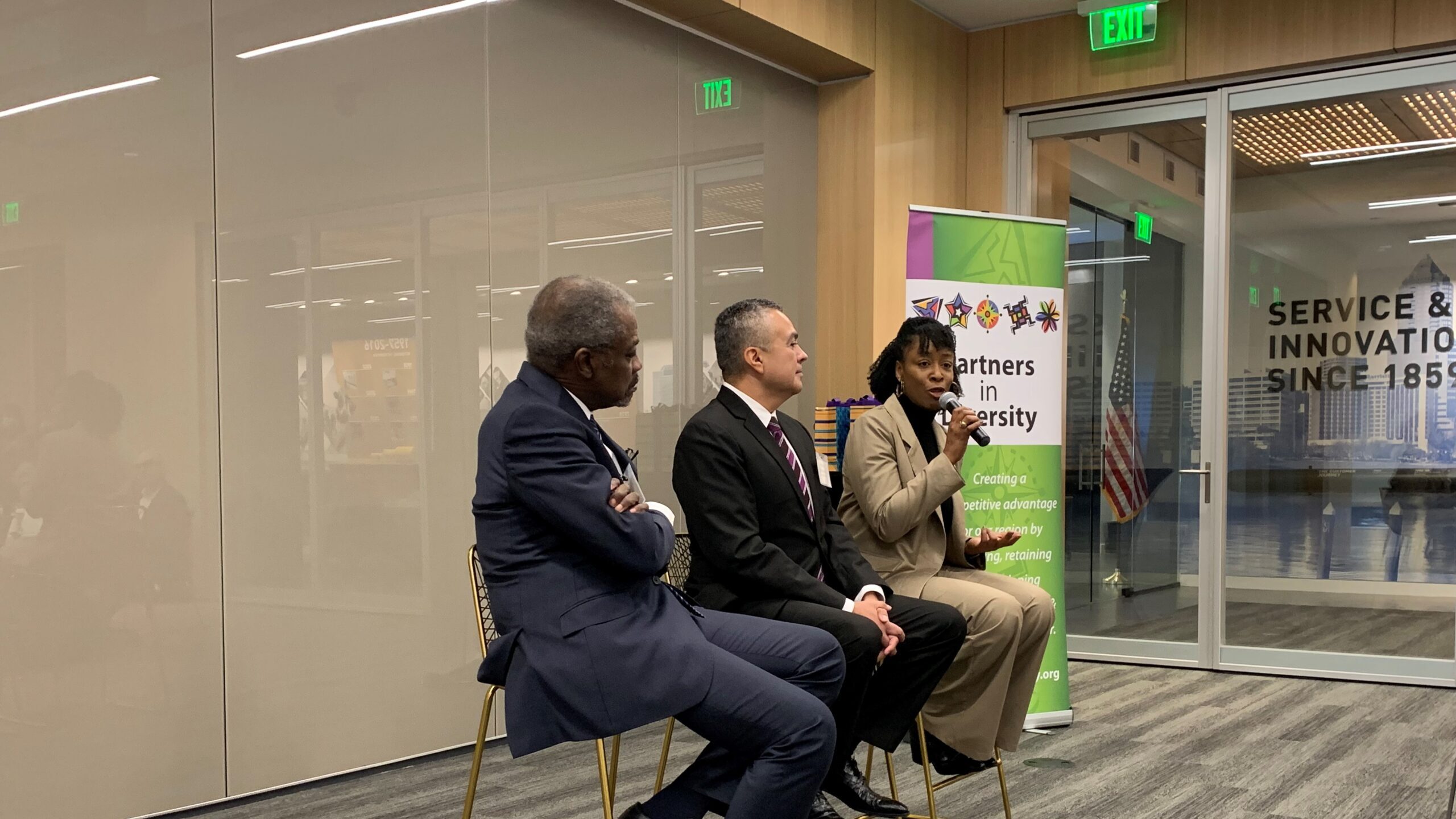 three people speaking at a CEO forum